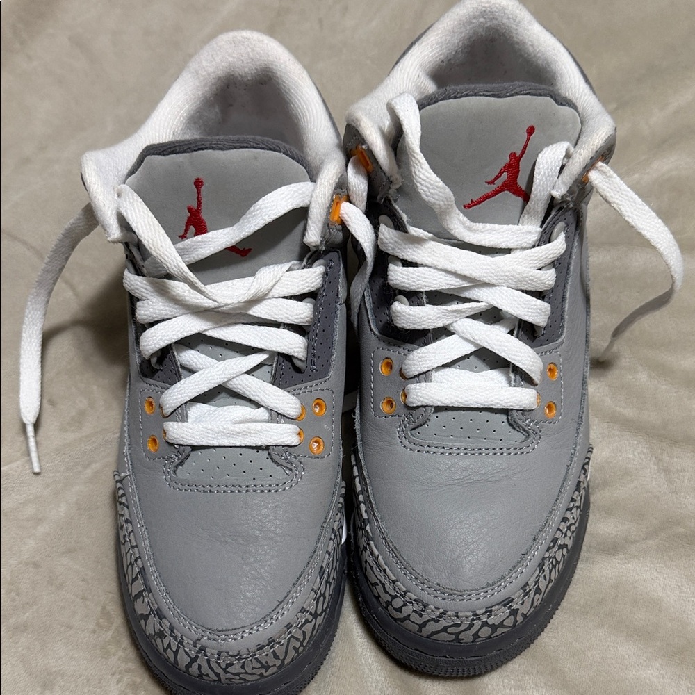 Gray and White Sneakers with Red Logo